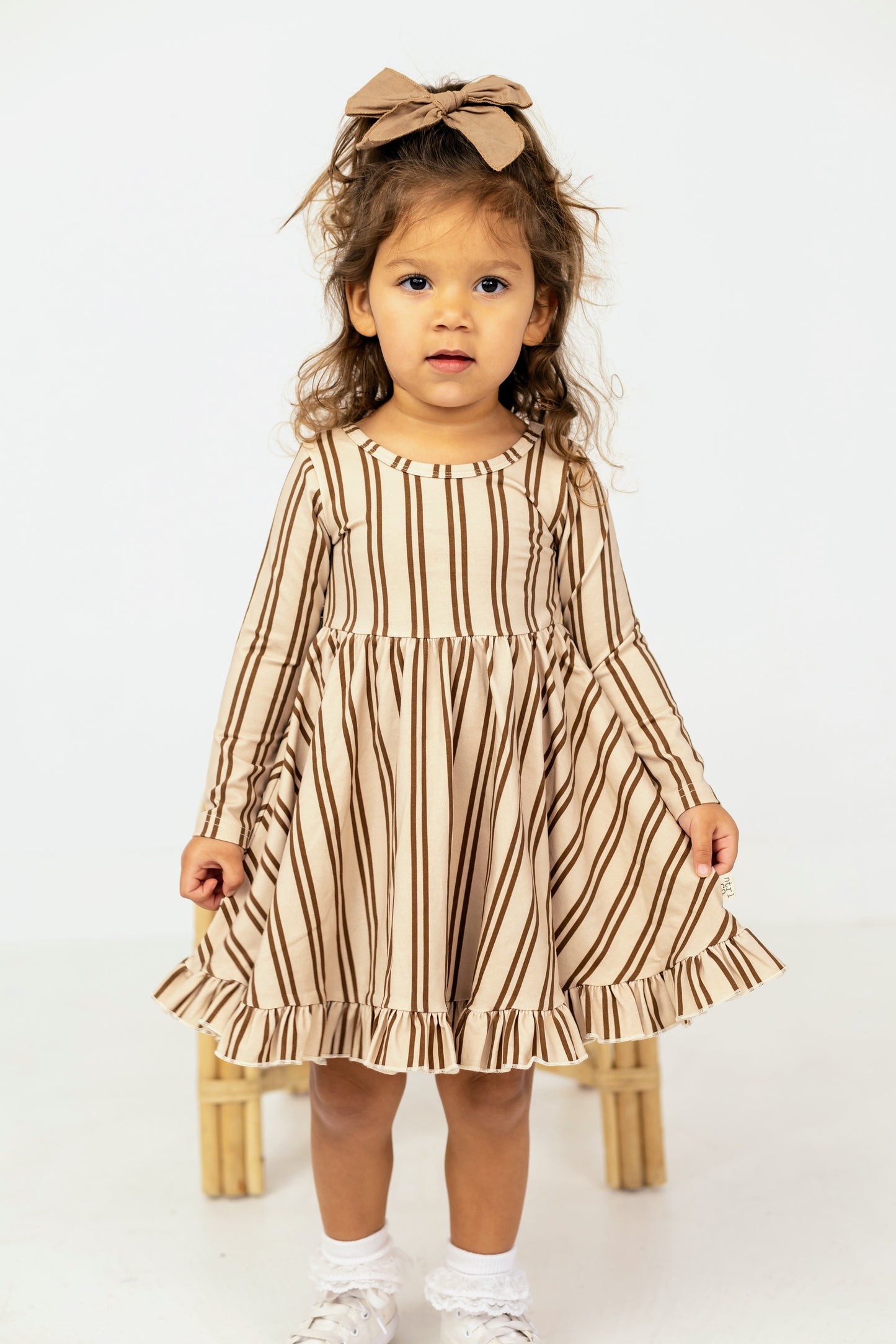 Neutral Lines Ruffled Hem Twirl Dress