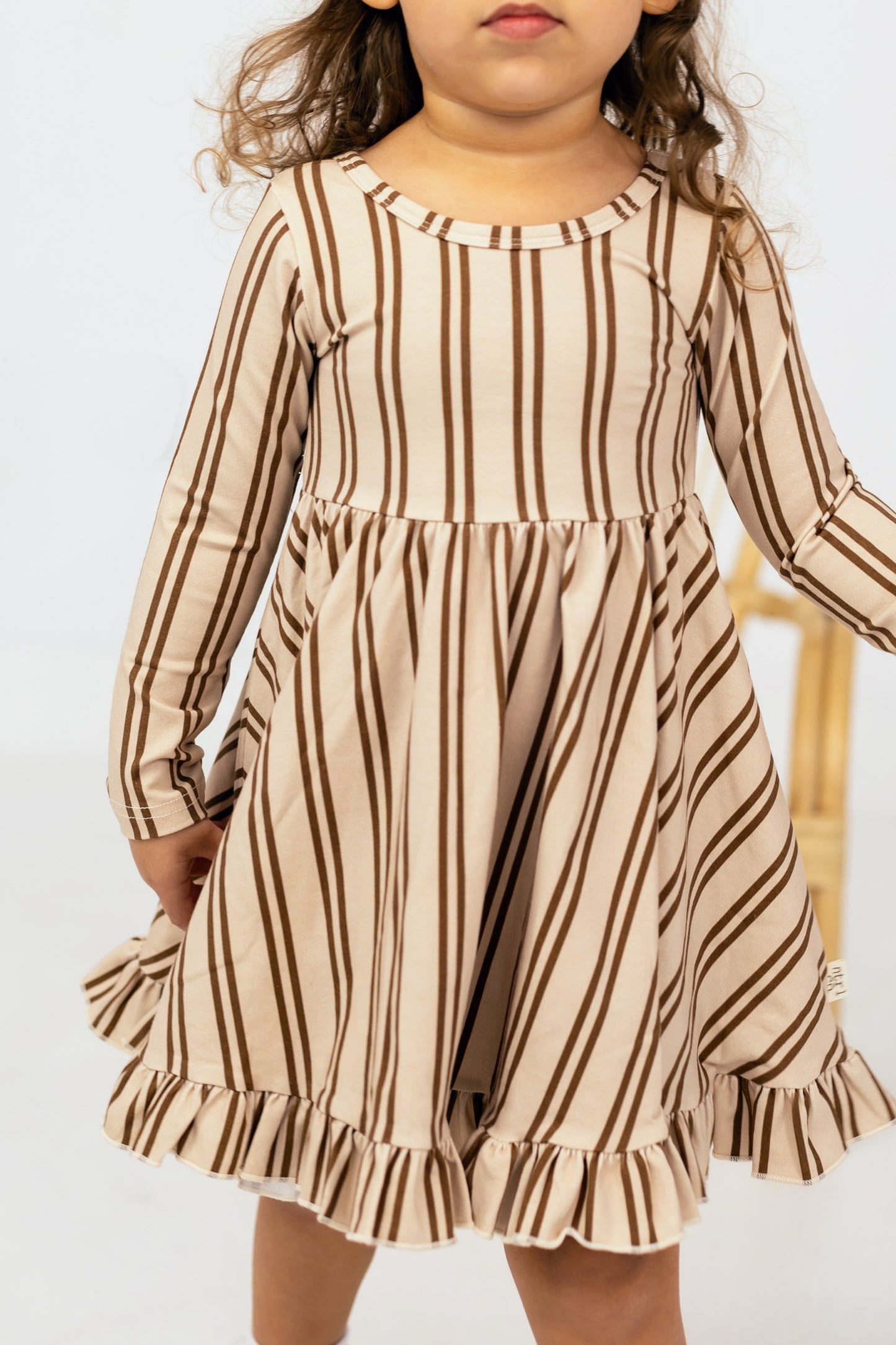Neutral Lines Ruffled Hem Twirl Dress
